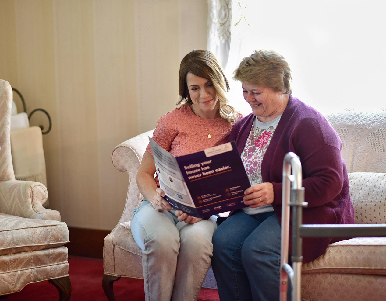 Senior homeowner reviewing home sale options with family