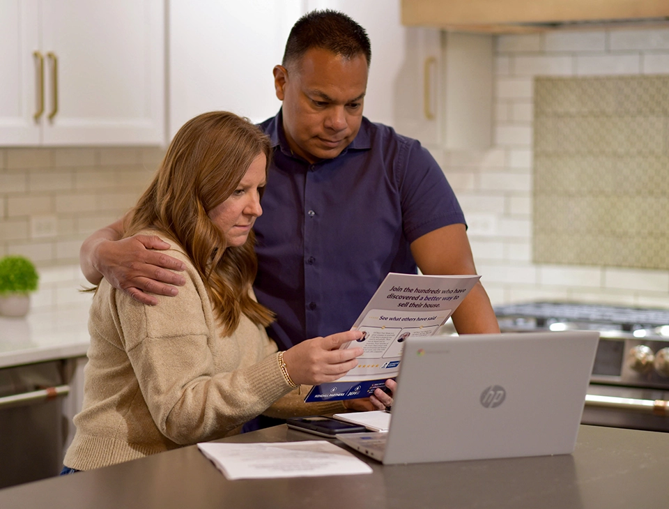 Family reviewing inherited house sale paperwork