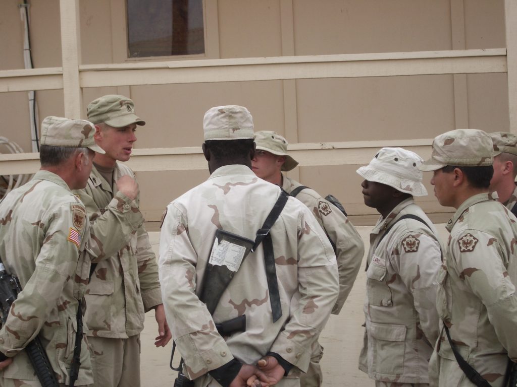 Jeff Nydegger serving in the U.S. Army alongside fellow soldiers during his military service.
