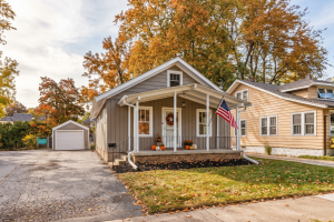 Chicago-area home surrounded by autumn foliage as homeowners prepare to sell an inherited house before winter.